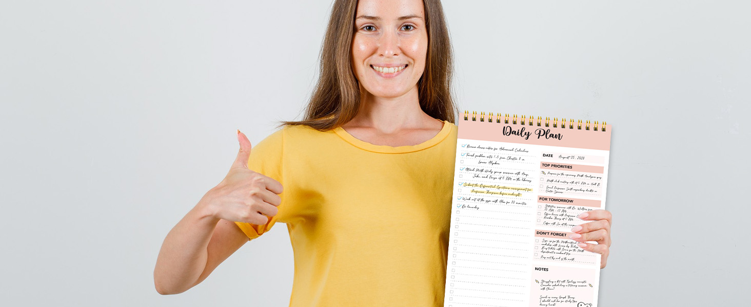 A teacher holding the note pads to do list, to do list notepad &amp; to do list pad in school.