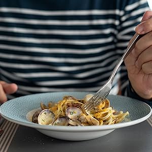 picture of a person eating bottarga with spaghetti