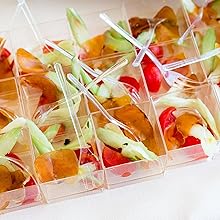 picture of bottarga with spring onion and cherry tomatoes in a little plate