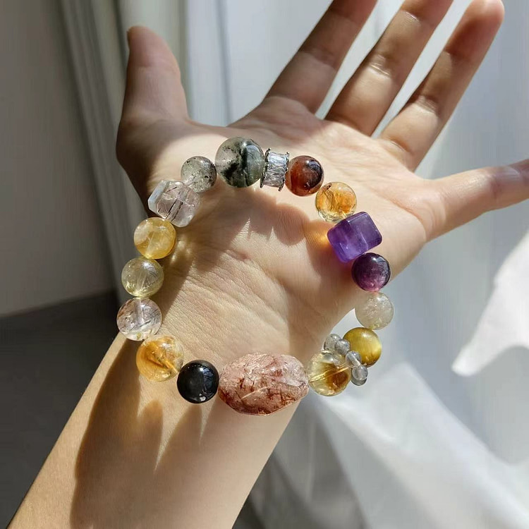 1 natural black gold super seven crystal 1 case
