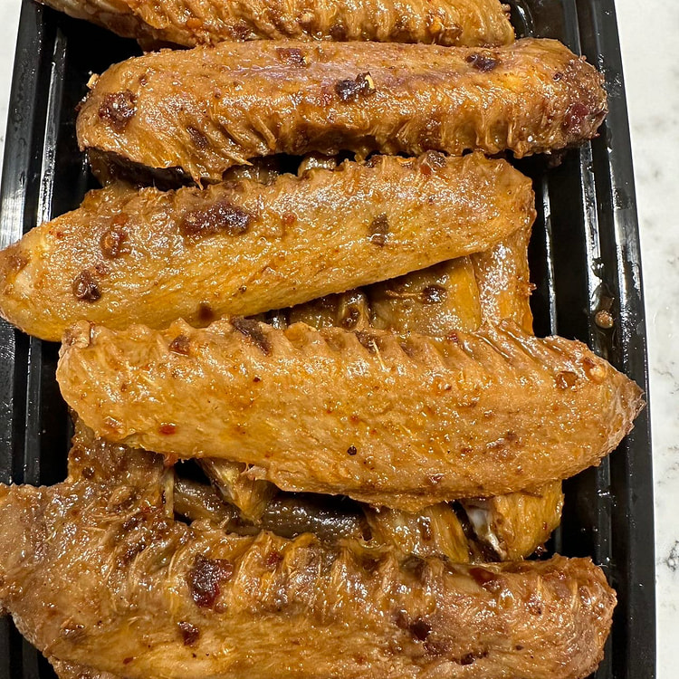 Spicy duck wing and feet 1 each