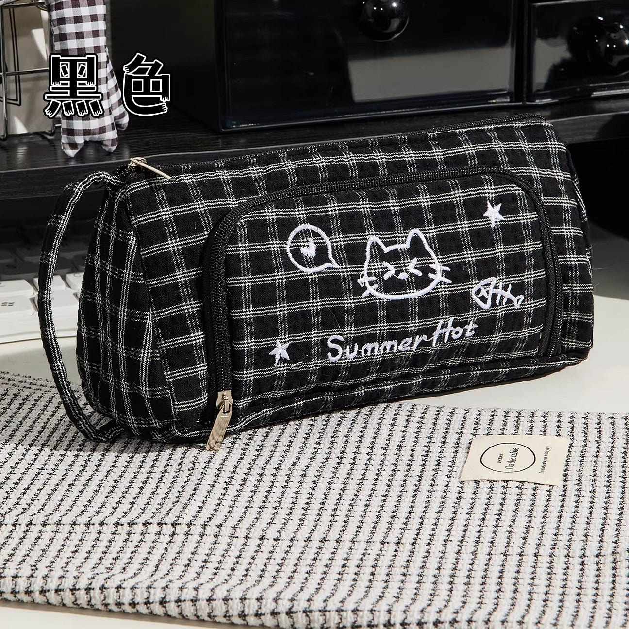 1 black plaid pencil case with a kitten design 1 each